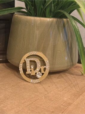 Monogram, gold, crystal brooch